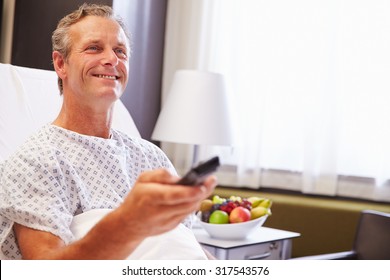 Male Patient In Hospital Bed Watching Television - Powered by Shutterstock