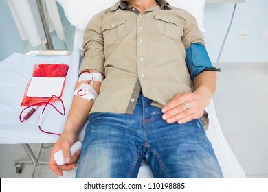 Male Patient Receiving A Blood Transfusion In Hospital Ward