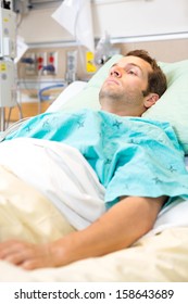 Male Patient Resting On Bed In Hospital