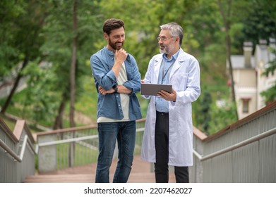 Male patient talking to the therapist regarding new emdicine - Shutterstock ID 2207462027