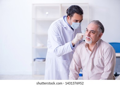 Male patient visiting doctor otolaryngologist - Powered by Shutterstock