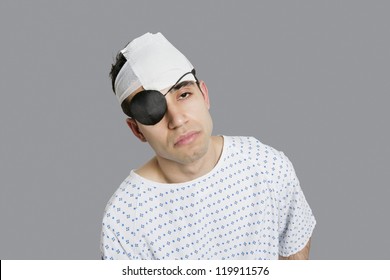 Male Patient Wearing An Eye Patch Suffering From Head Injury