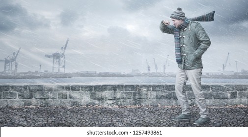 Male Pedestrian Is Facing Strong Wind And Rain