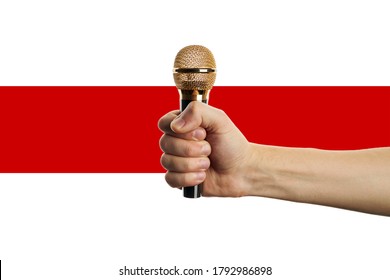 Male Person Holding Microphone At His Fist Over Belarus Flag Background. Hot News Symbol. Freedom Of Speech Concept.