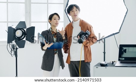 Male photographer and female designer