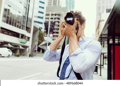 Male Photographer Taking Picture