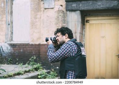 Male Photographer Taking Picture, Photojournalist Concept