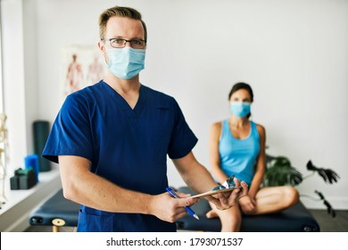 A Male Physical Therapist With Female Patient On The Back