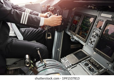 Male Pilot Use Steering Wheel To Fly On Airplane