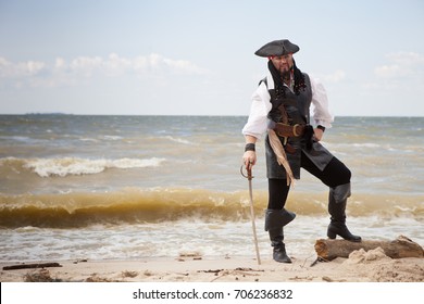 Male Pirate With A Sword On The Seashore