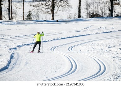 Male practicing skiing as a sport and recreational activity, elements of skate cross country technique.