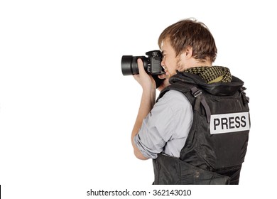 Male Press Photographer Wears A Protective Vest And Takes Photos With A Professional Camera