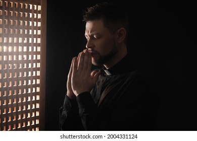 Male Priest In Confession Booth