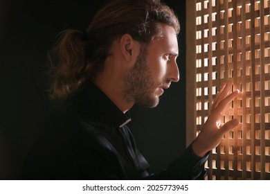 Male Priest In Confession Booth