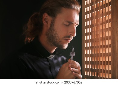 Male Priest In Confession Booth