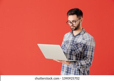 Male Programmer With Laptop On Color Background