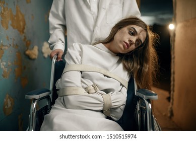 Male psychiatrist and female patient in wheelchair