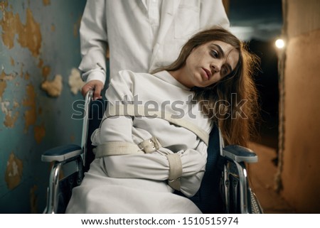Male psychiatrist and female patient in wheelchair