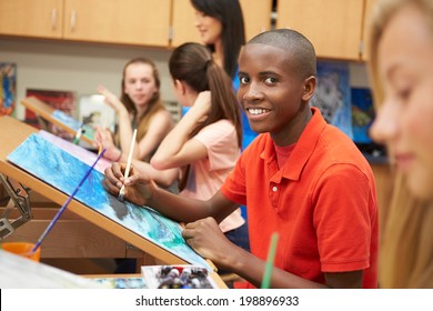 Male Pupil In High School Art Class