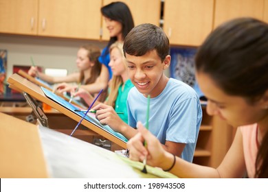 Male Pupil In High School Art Class