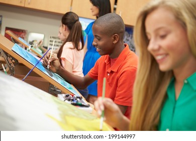 Male Pupil In High School Art Class