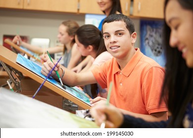 Male Pupil In High School Art Class