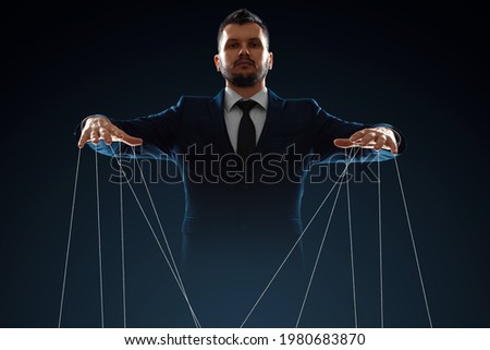 Male, puppeteer controls with threads. The concept of world conspiracy, world government, manipulation, world control