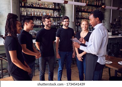 Male Restaurant Manager With Digital Tablet Giving Team Talk To Waiting Staff - Shutterstock ID 1734541439