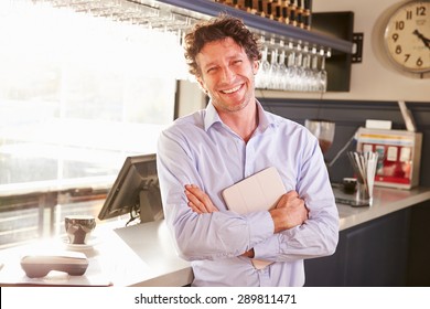 Male Restaurant Owner Holding Digital Tablet, Portrait