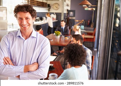 Male Restaurant Owner, Portrait With Arms Crossed