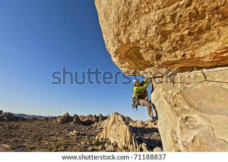 Similar – Image, Stock Photo Rock climber clinging to a cliff.