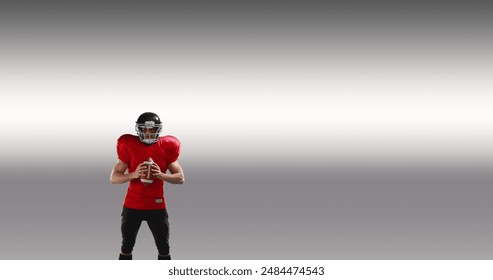 Male rugby player wearing helmet holding rugby ball celebrating against grey background. sports and technology concept - Powered by Shutterstock