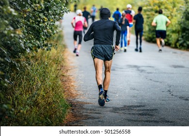 Male Runner Of Average Years Running Marathon In Fall City Park