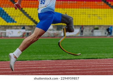 male runner para athlete on limb deficiency running track stadium, summer para athletics championships - Powered by Shutterstock