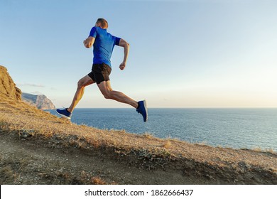 Male Runner Run Uphill In Background Sky And Sea