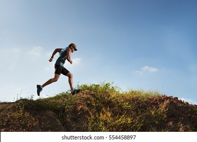 Male Runner of Trail. He was running fast on the mountain - Powered by Shutterstock