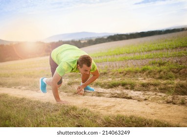 Male Runner Tripping Over And Falling Down On The Cross Country Trail