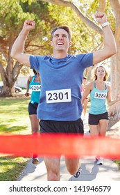 Male Runner Winning Marathon