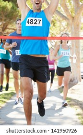 Male Runner Winning Marathon