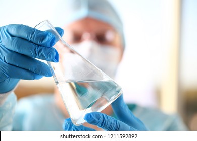 Male scientist hold in arm empty vials closeup. Chemical lab exam food additives medical blend concentrate acid measurement innovation drug toxic poison infection measure microbiology concept