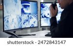 Male security guard, radio and speaking by cctv monitor for protection, data center or building safety. Inspection, control room with man and footage in video surveillance agency, computer and watch