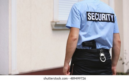 Male Security Guard Standing Back Outdoors Stock Photo (Edit Now) 489499834