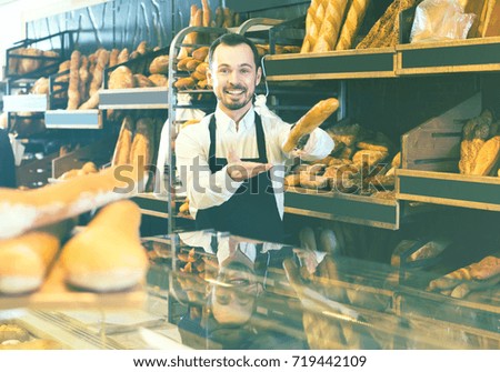 Similar – Image, Stock Photo African man works in pastry shop.