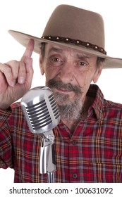 Male Senior Country Singer With Microphone And Cowboy Hat