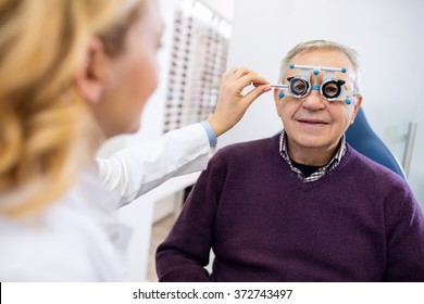 Male Senior In Eye Clinic Examine Eyes