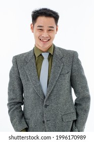 Male Short Black Hair, Dark Eyebrows, Chinese Eyes, Wearing Olive Green Shirt, Gray Tie, Dark Gray Suit , Blue Pants, Stand Look At Camera, Left Hand In Pants Pocket, Right Hand Free, Formal Style