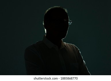 Male Silhouette With Backlit And Shadow In Glasses.