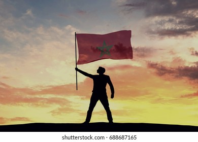 Male Silhouette Figure Waving Morocco Flag. 3D Rendering