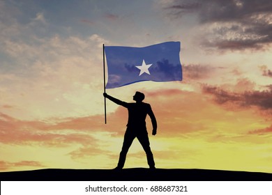 Male Silhouette Figure Waving Somalia Flag. 3D Rendering