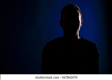 Male Silhouette On A Blue Background